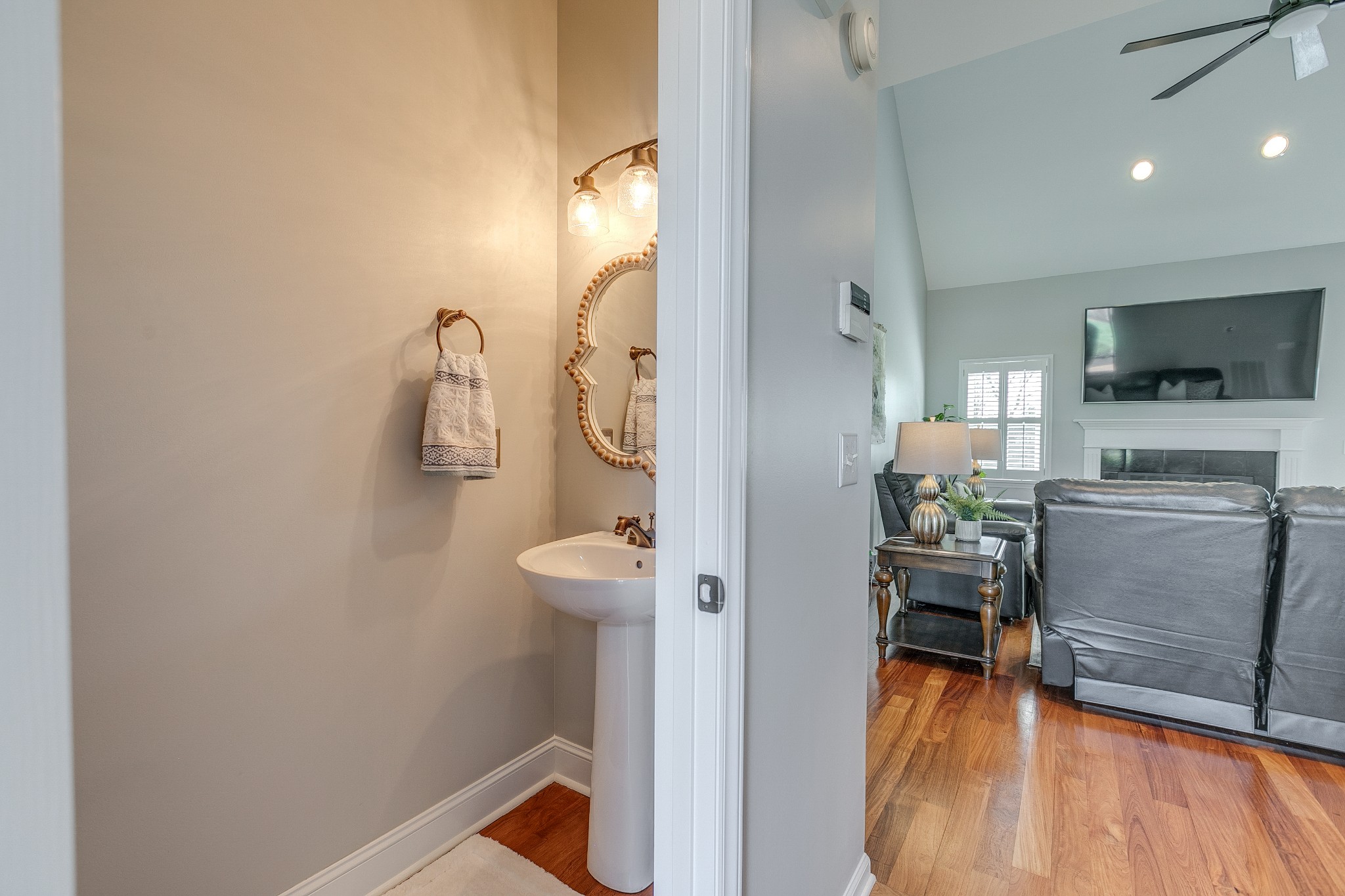 2407 Taylor Close Murfreesboro, TN 37130 - Photo 5 of 38 a room with stainless steel appliances a couch and a flat screen tv