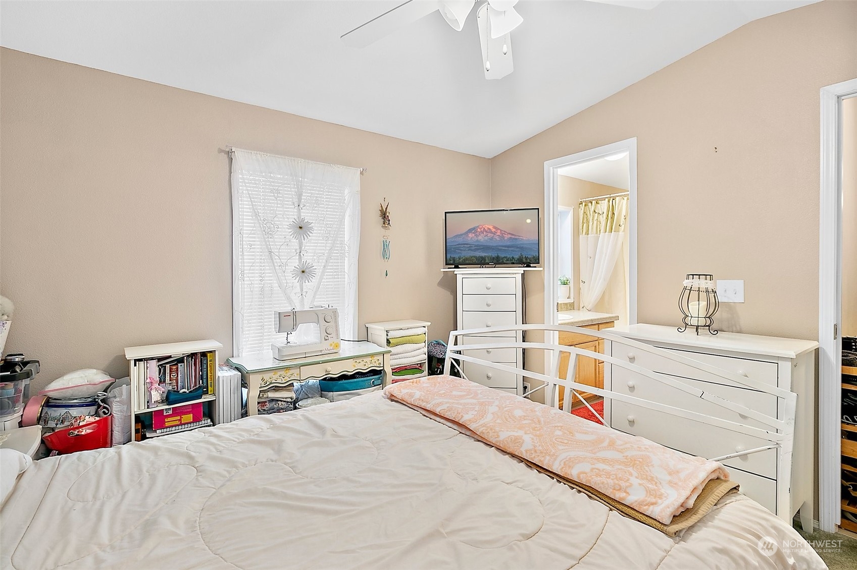 2101 South 324th Street, Unit 32 Federal Way, WA 98003 - Photo 15 of 30 a bedroom with a bed and a chandelier