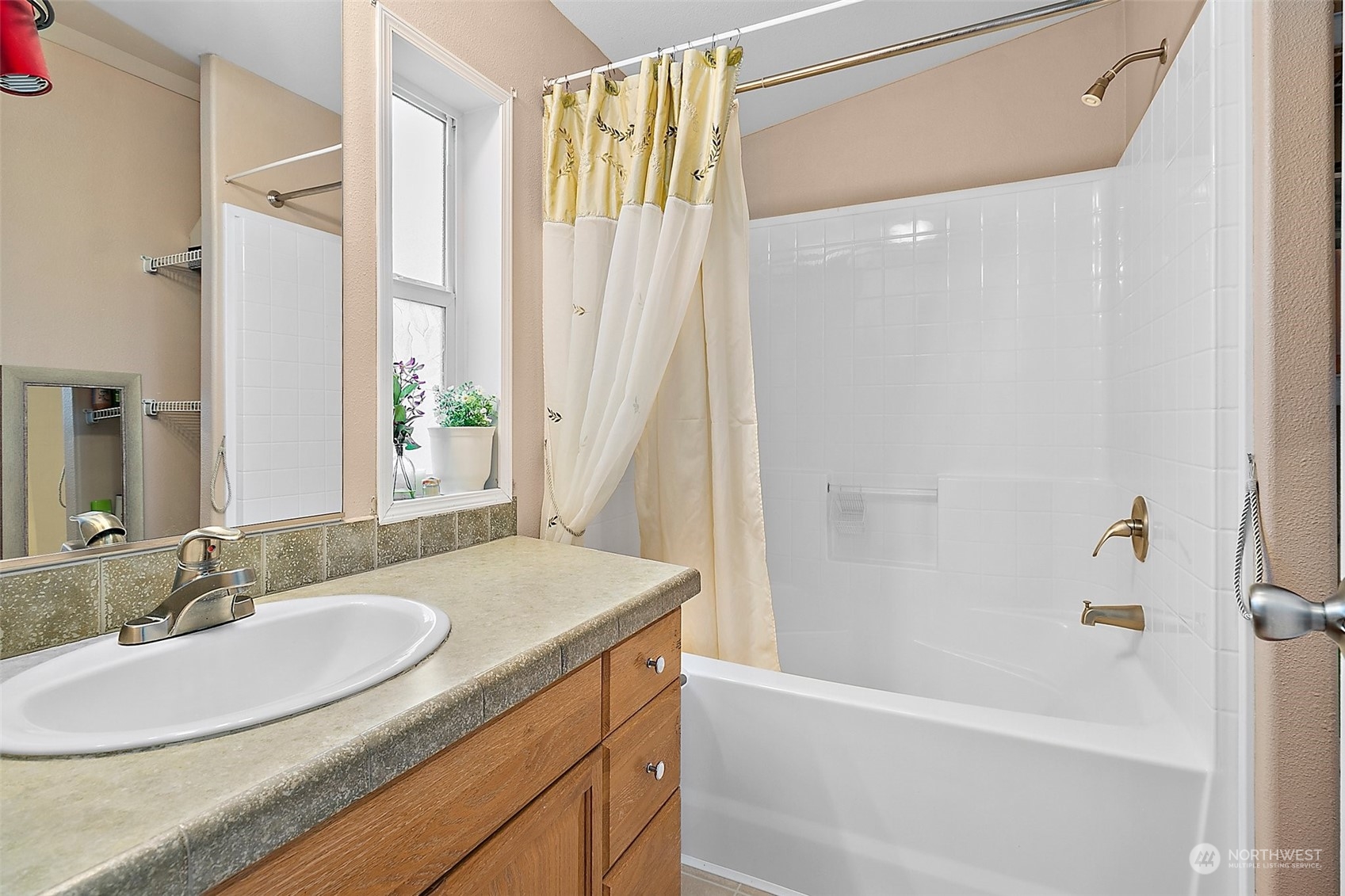 2101 South 324th Street, Unit 32 Federal Way, WA 98003 - Photo 16 of 30 a bathroom with a granite countertop sink tub and a mirror