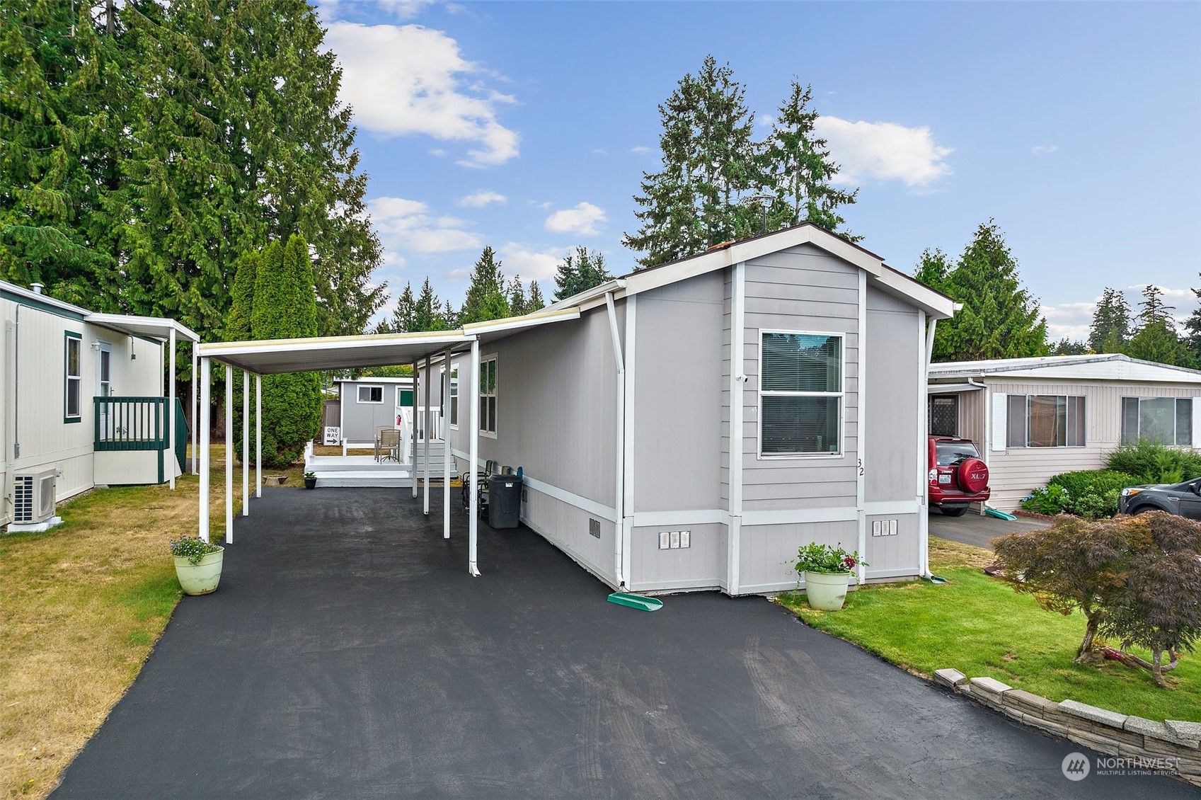 2101 South 324th Street, Unit 32 Federal Way, WA 98003 - Photo 2 of 30 a view of a house with a yard