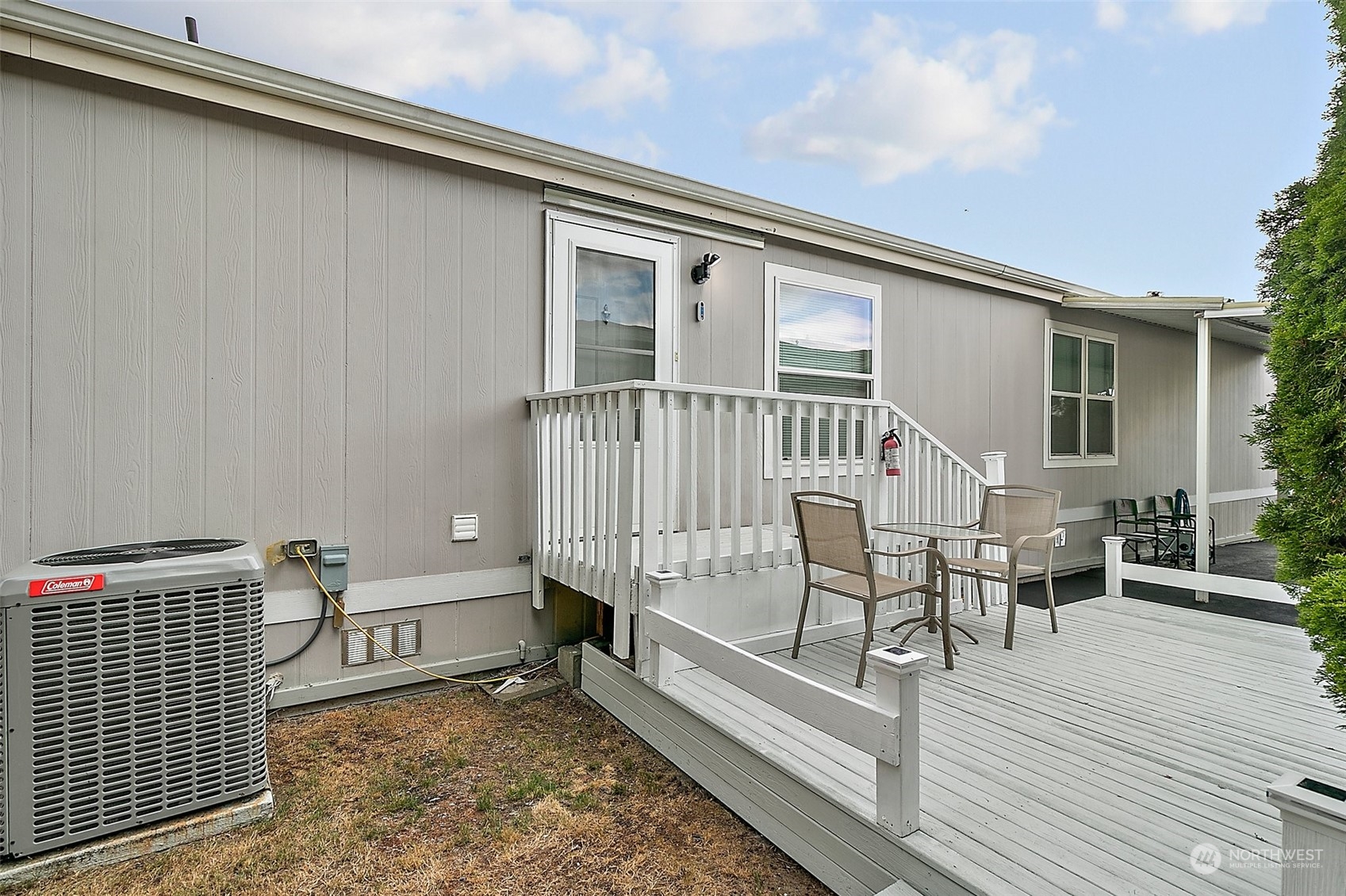2101 South 324th Street, Unit 32 Federal Way, WA 98003 - Photo 23 of 30 a view of a balcony with chairs and wooden floor