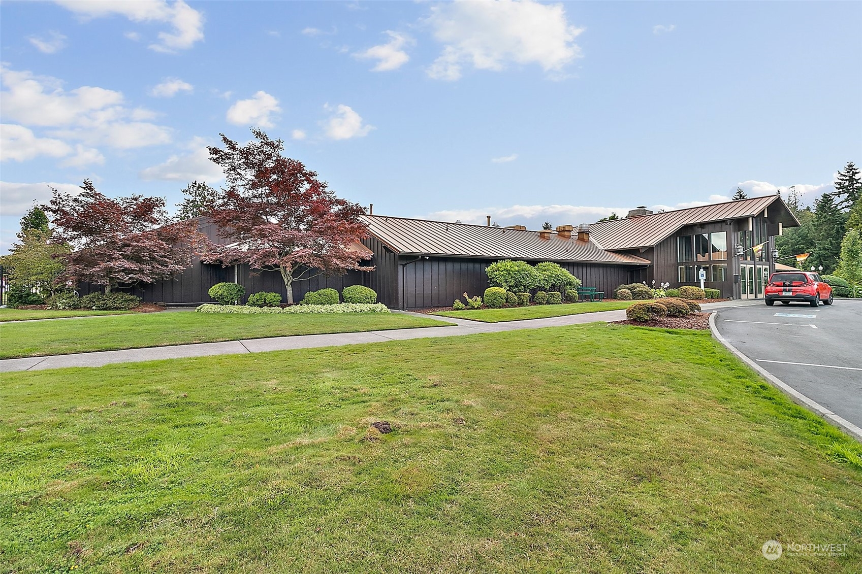 2101 South 324th Street, Unit 32 Federal Way, WA 98003 - Photo 28 of 30 a view of a house with a big yard potted plants and large tree