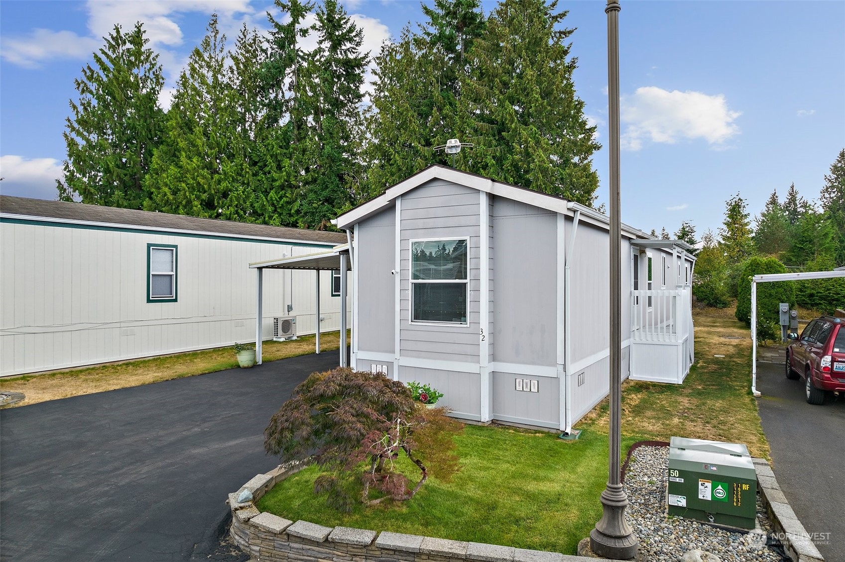 2101 South 324th Street, Unit 32 Federal Way, WA 98003 - Photo 3 of 30 a front view of a house with garden