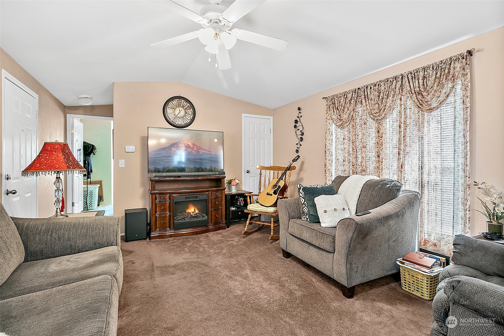 2101 South 324th Street, Unit 32 Federal Way, WA 98003 - Photo 5 of 30 a living room with furniture and a flat screen tv