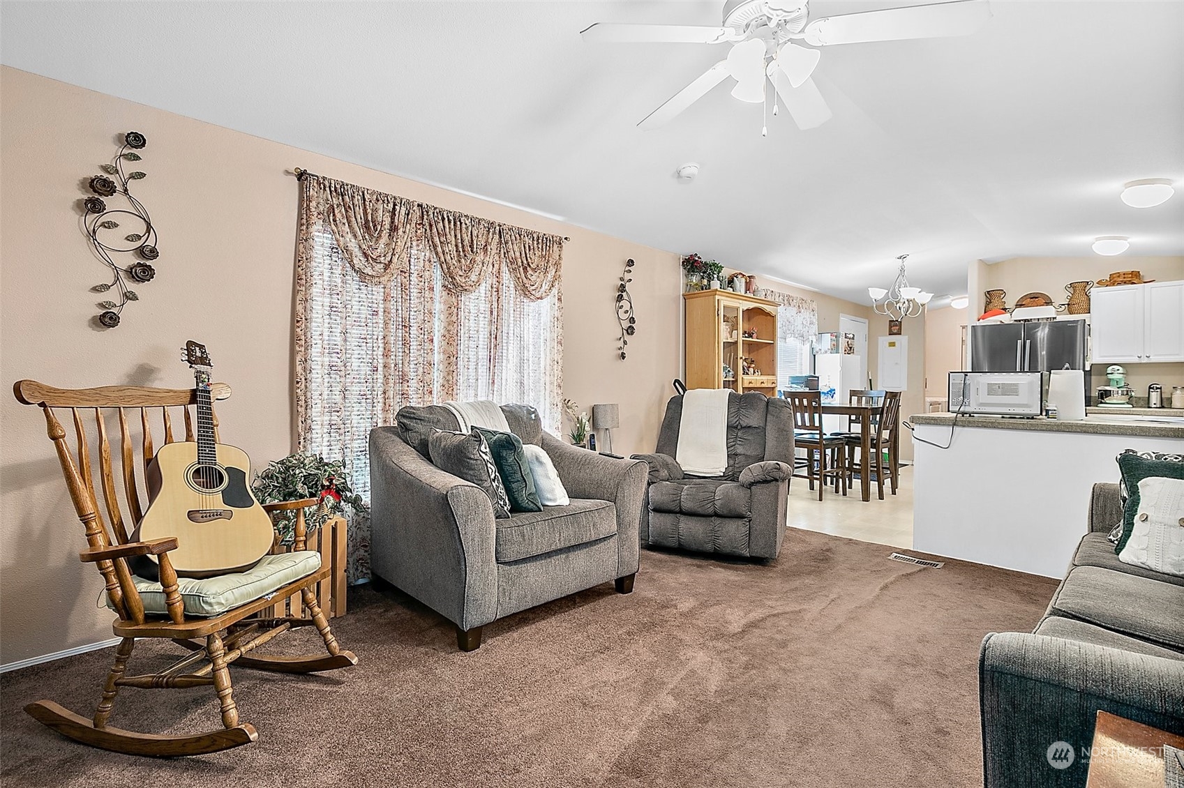 2101 South 324th Street, Unit 32 Federal Way, WA 98003 - Photo 6 of 30 a living room with furniture and a large window