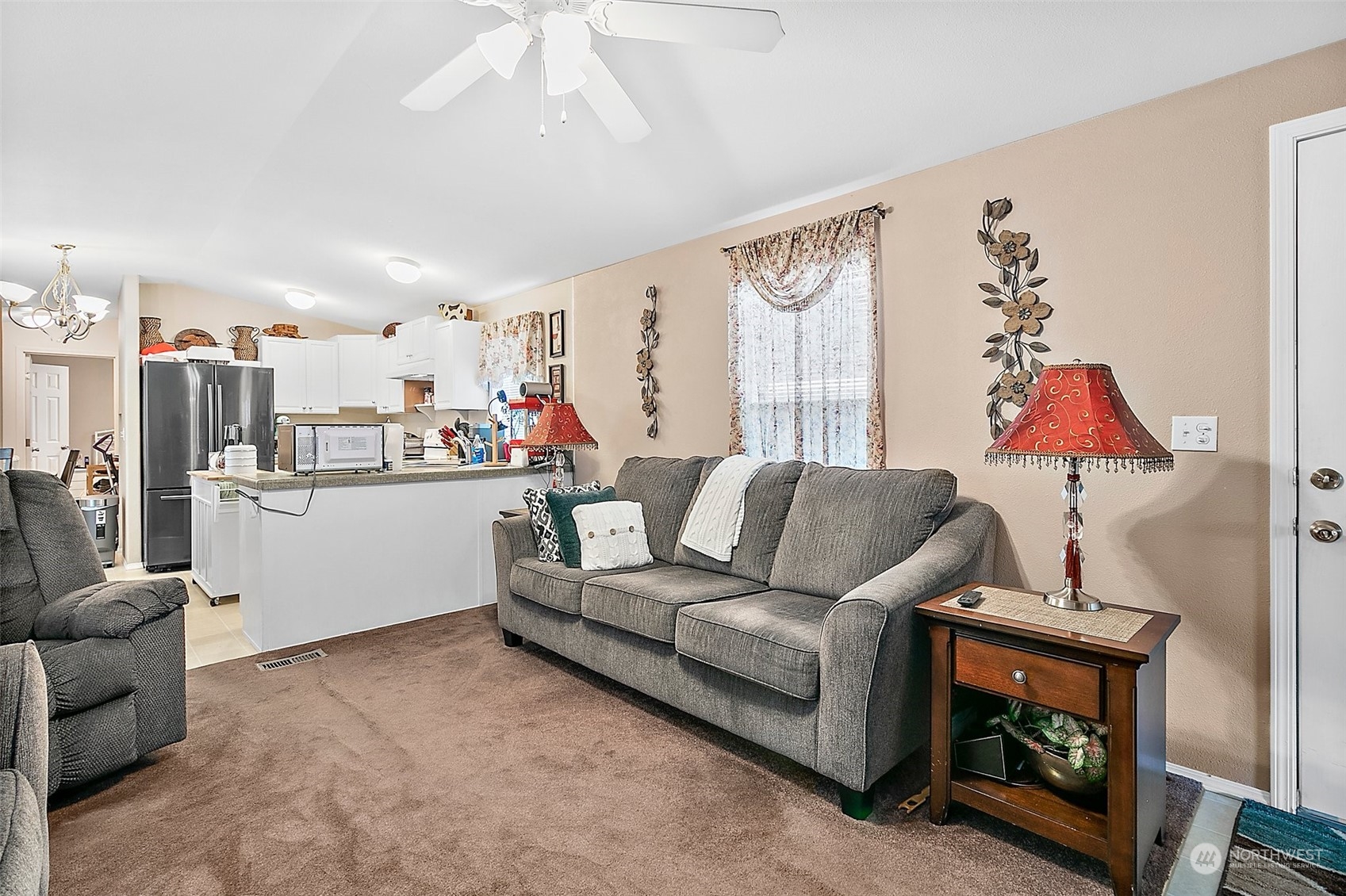 2101 South 324th Street, Unit 32 Federal Way, WA 98003 - Photo 7 of 30 a living room with furniture and a flat screen tv