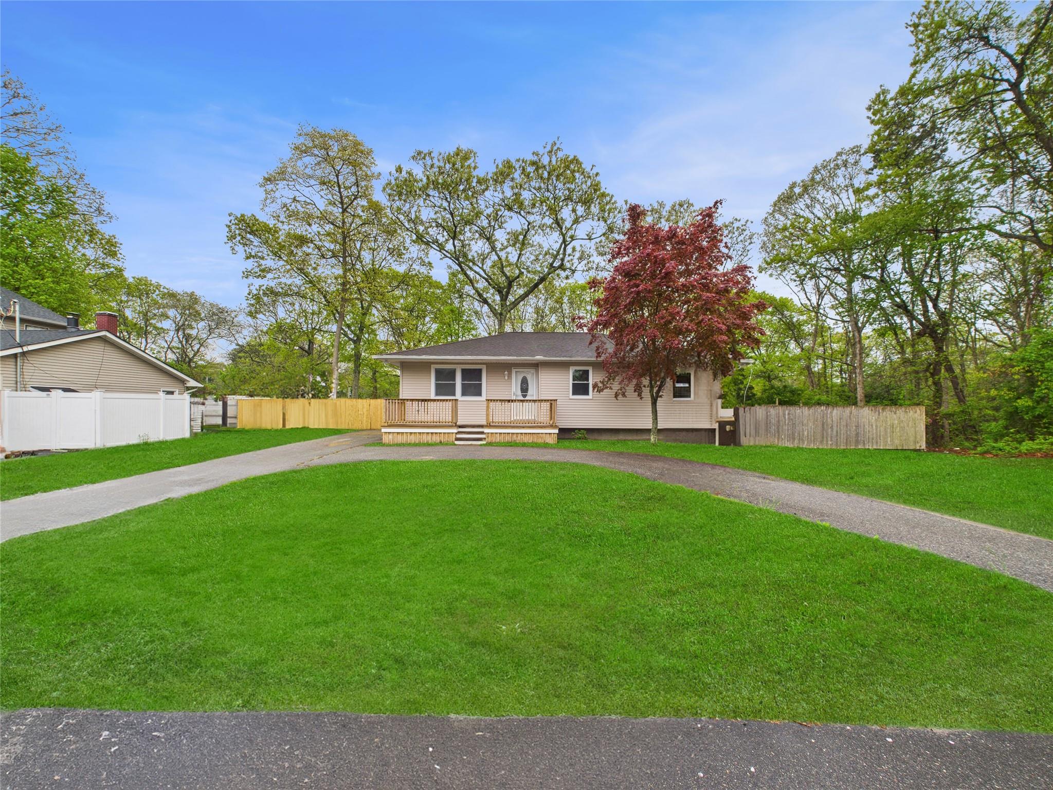 a view of a house with a backyard