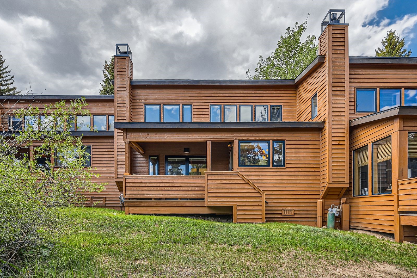 440 Tennis Club Road, Unit 1321 Keystone, CO 80435 - Photo 24 of 42 Step off the deck onto a grassy area or stroll down to the community pool, offering both relaxation and recreation just steps away.
