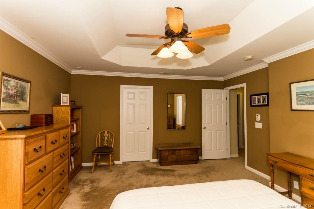 153 Snead Road, Unit 72 Fort Mill, SC 29715 - Photo 14 of 17 a bedroom with a bed and furniture
