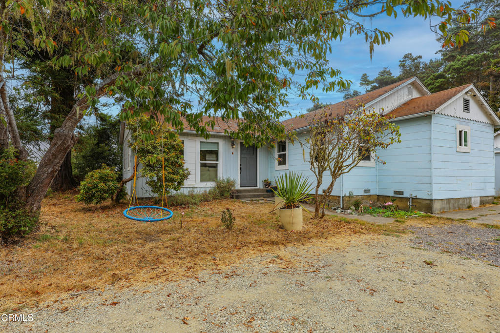 17621 Highway 1 Fort Bragg, CA 95437 - Photo 1 of 23 a view of a house with a yard and large tree