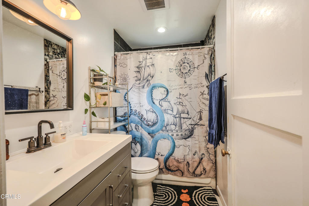 17621 Highway 1 Fort Bragg, CA 95437 - Photo 14 of 23 a bathroom with a sink and mirror with toilet