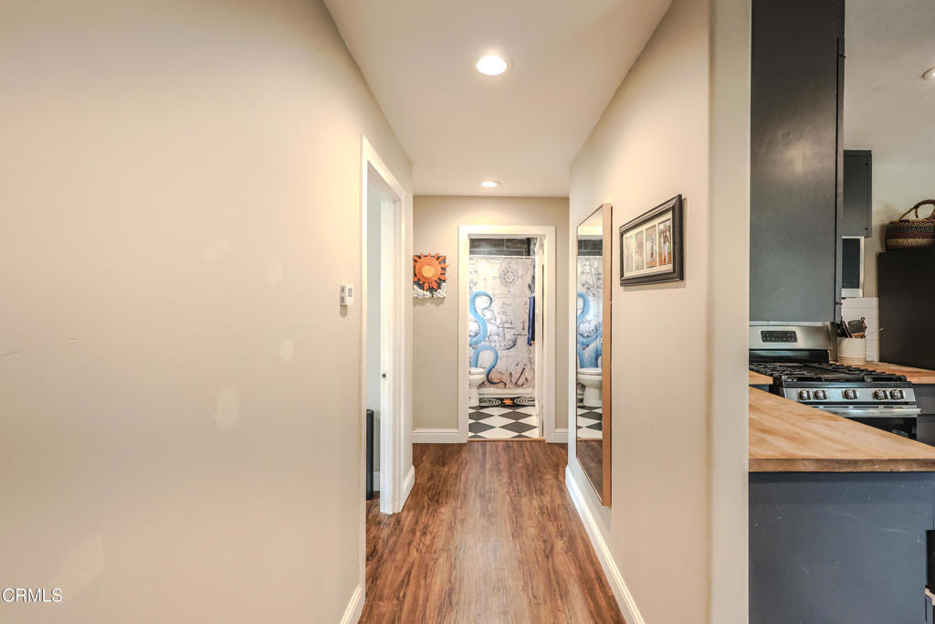 17621 Highway 1 Fort Bragg, CA 95437 - Photo 7 of 23 a view of a hallway with wooden floor and a living room