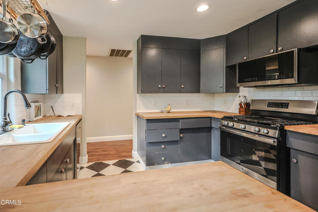 17621 Highway 1 Fort Bragg, CA 95437 - Photo 9 of 23 a kitchen with stainless steel appliances granite countertop a sink stove and microwave