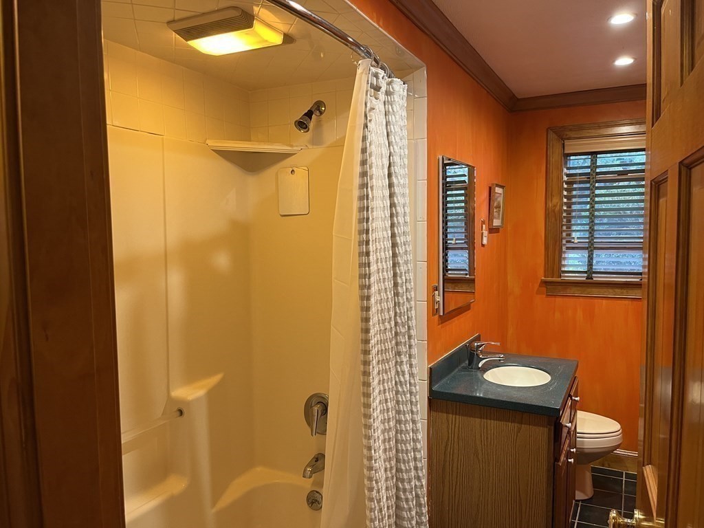 9 Clarissa Road Chelmsford, MA 01824 - Photo 11 of 19 a bathroom with a sink a mirror and a shower