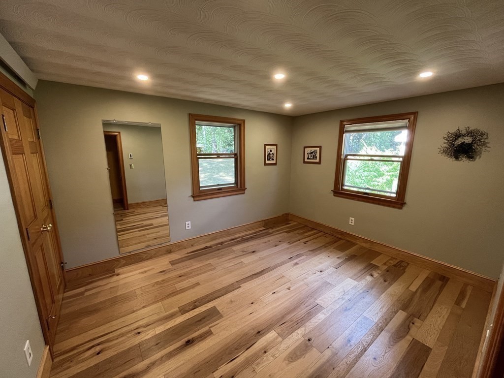 9 Clarissa Road Chelmsford, MA 01824 - Photo 8 of 19 an empty room with wooden floor and windows