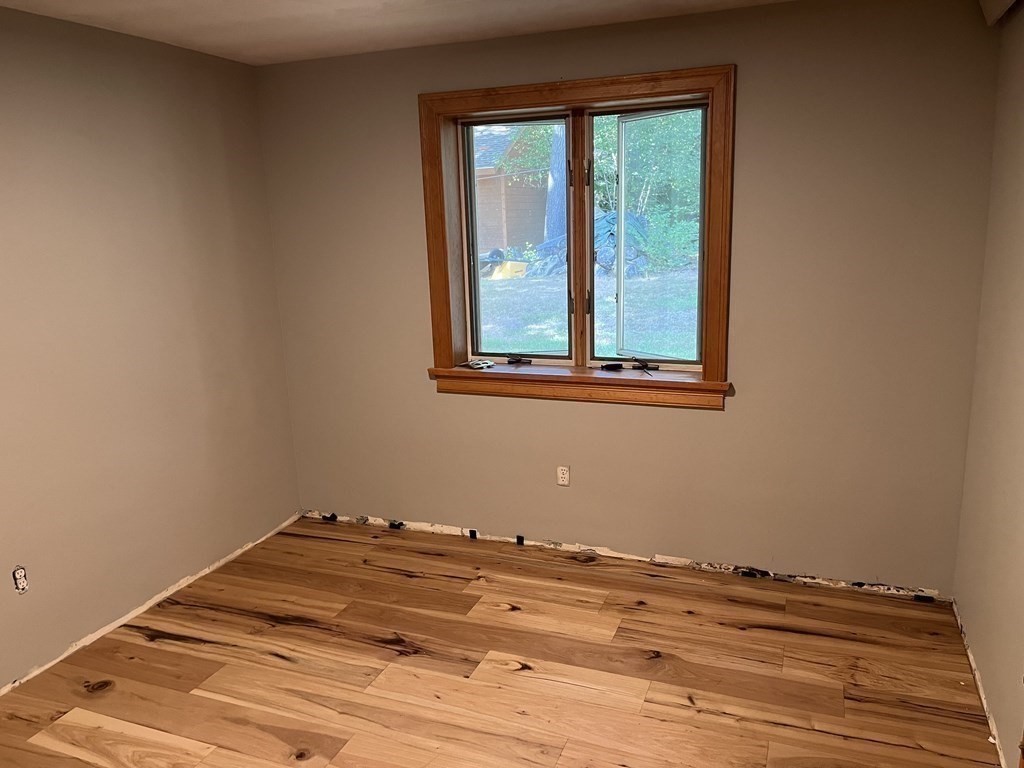 9 Clarissa Road Chelmsford, MA 01824 - Photo 9 of 19 a view of a room with wooden floor and a window