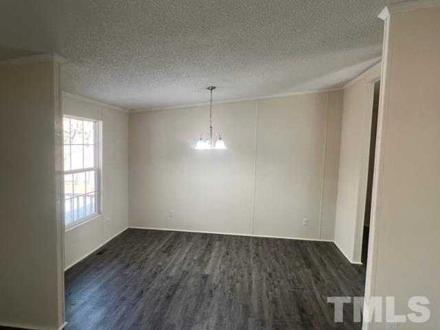 4656 Belltown Road Oxford, NC 27565 - Photo 15 of 24 an empty room with wooden floor and windows