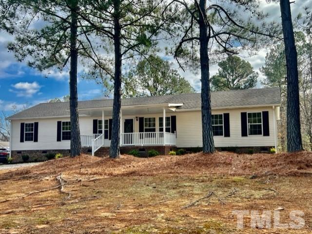 4656 Belltown Road Oxford, NC 27565 - Photo 4 of 24 a view of a house with a tree in front of it