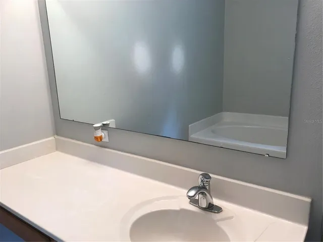a bathroom with a sink and bathtub