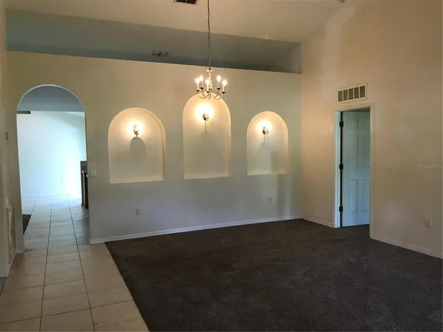 a view of a livingroom with wooden floor
