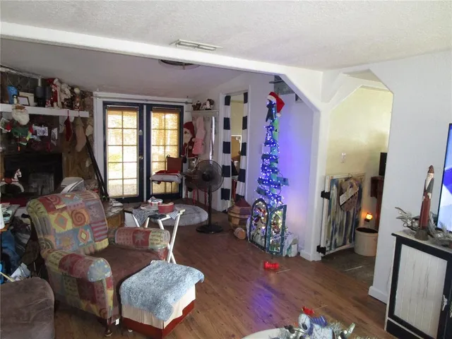 a living room with furniture window and wooden floor
