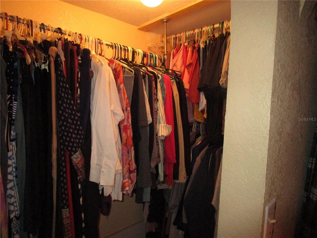 17609 Bathurst Avenue Spring Hill, FL 34610 - Photo 23 of 60 a view of walk in closet with clothes