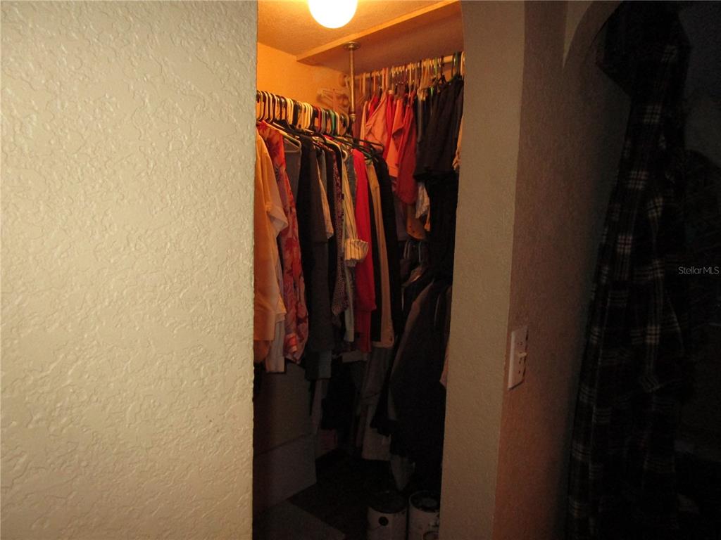 17609 Bathurst Avenue Spring Hill, FL 34610 - Photo 24 of 60 a view of walk in closet with clothes