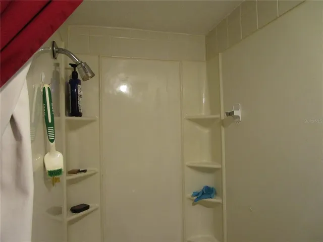 a view of backyard with sitting area