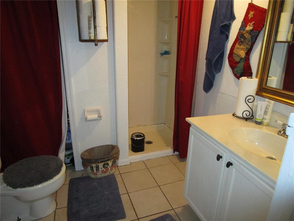 17609 Bathurst Avenue Spring Hill, FL 34610 - Photo 37 of 60 a bathroom with a sink and a toilet
