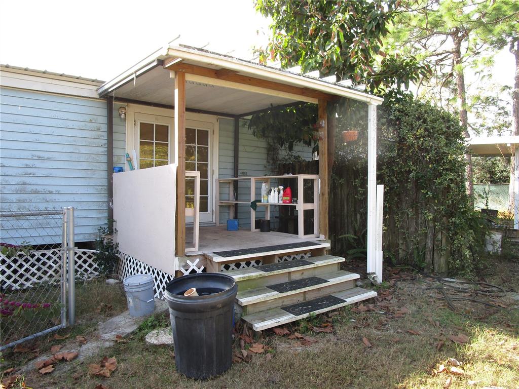 17609 Bathurst Avenue Spring Hill, FL 34610 - Photo 39 of 60 a front view of a house with porch