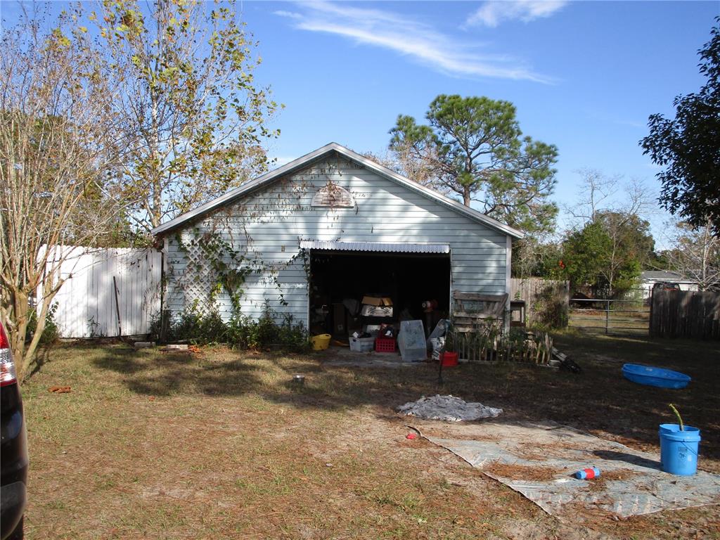 17609 Bathurst Avenue Spring Hill, FL 34610 - Photo 42 of 60 a view of a house with a patio