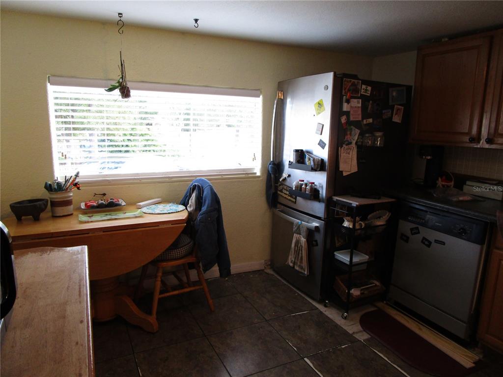 17609 Bathurst Avenue Spring Hill, FL 34610 - Photo 6 of 60 a dining room with furniture and window
