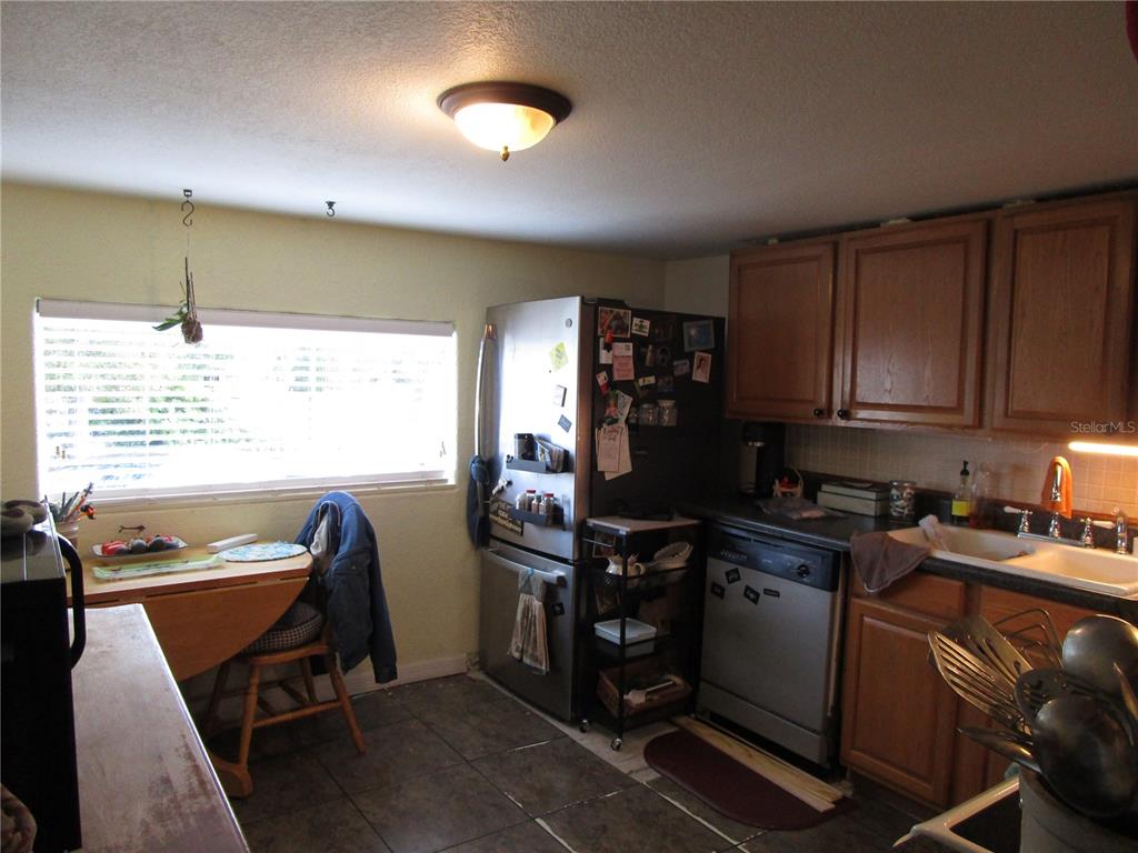 17609 Bathurst Avenue Spring Hill, FL 34610 - Photo 8 of 60 a view of a workspace with furniture and a window