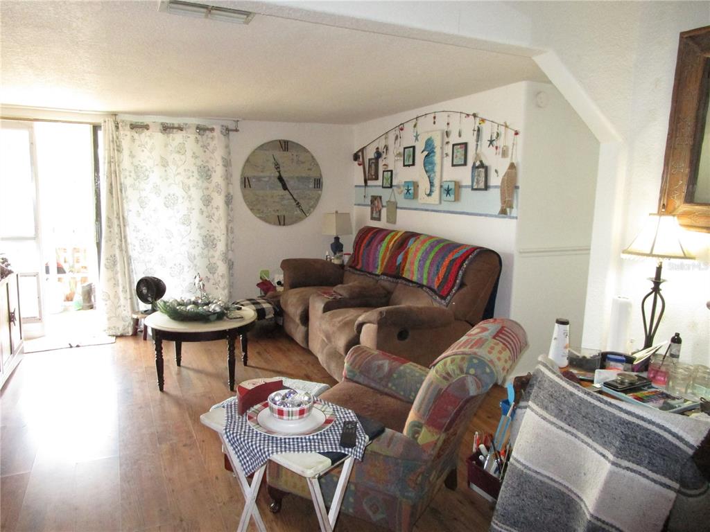 17609 Bathurst Avenue Spring Hill, FL 34610 - Photo 9 of 60 a living room with furniture and a large window