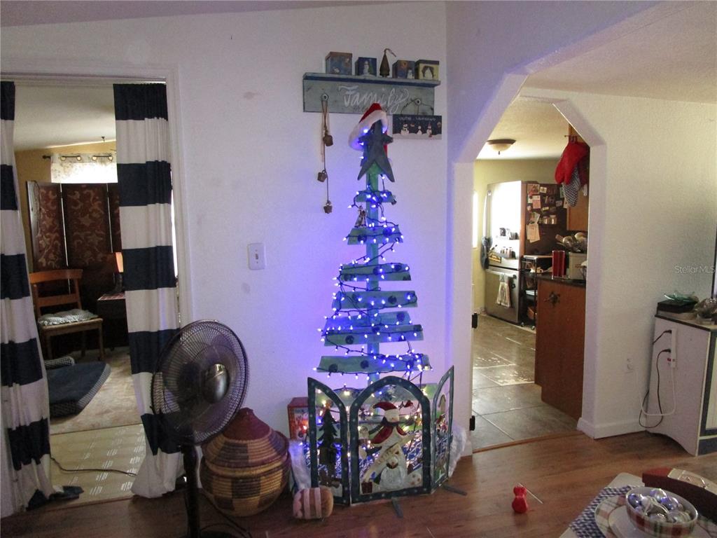 17609 Bathurst Avenue Spring Hill, FL 34610 - Photo 10 of 60 a living room with furniture and a fireplace