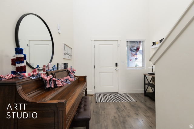 1713 South Windemere Road Santaquin, UT 84655 - Photo 4 of 40 Entryway featuring wood-finish flooring, a white door with dark hardware, and a high ceiling