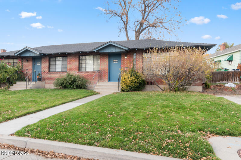 a front view of a house with garden