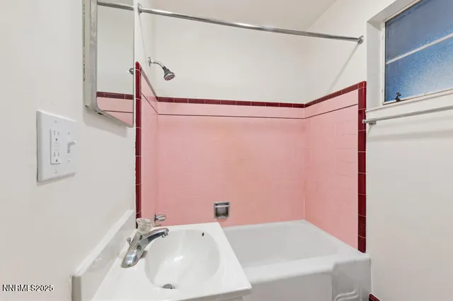 a bathroom with a sink and a shower