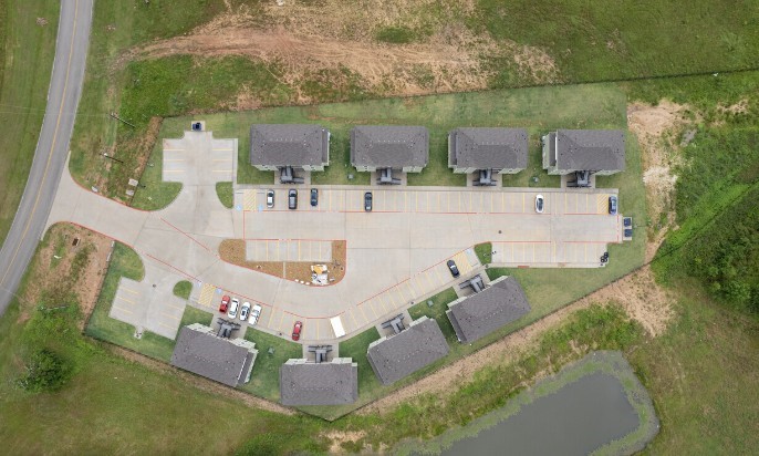 274 Plez Morgan, Unit F Montgomery, TX 77356 - Photo 13 of 13 an aerial view of a house with outdoor space