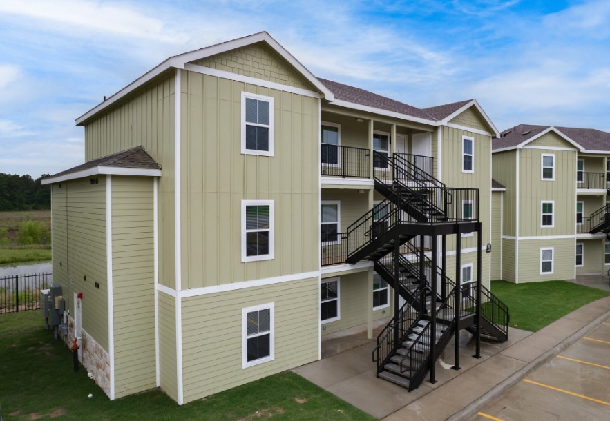 274 Plez Morgan, Unit F Montgomery, TX 77356 - Photo 4 of 13 a front view of a house with a yard
