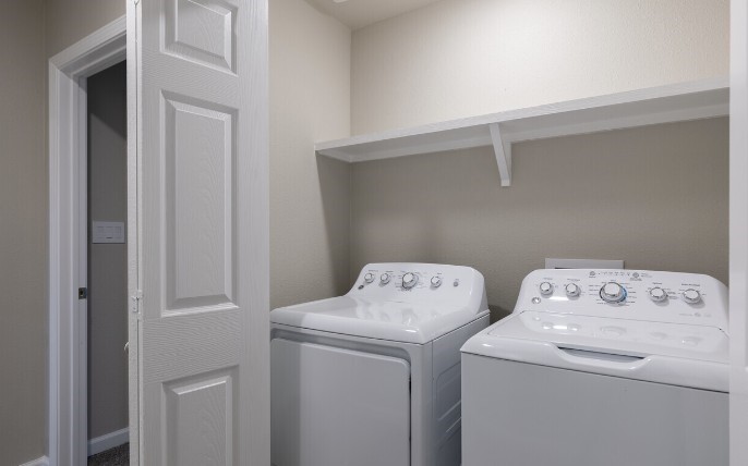274 Plez Morgan, Unit F Montgomery, TX 77356 - Photo 6 of 13 a utility room with dryer and washer