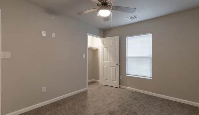 a kitchen with stainless steel appliances a refrigerator and microwave