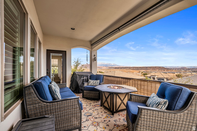2311 South 1340 West St. George, UT 84770 - Photo 21 of 56 View of patio / terrace with area for grilling, a mountain view, and an outdoor living space with a fire pit