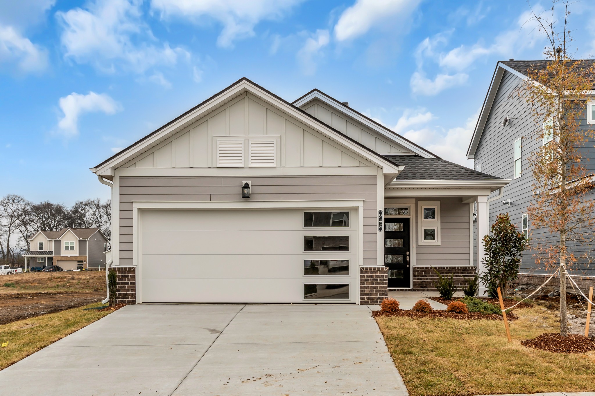 945 Brooklyn Xing Road Gallatin, TN 37066 - Photo 1 of 15 a front view of a house with garage