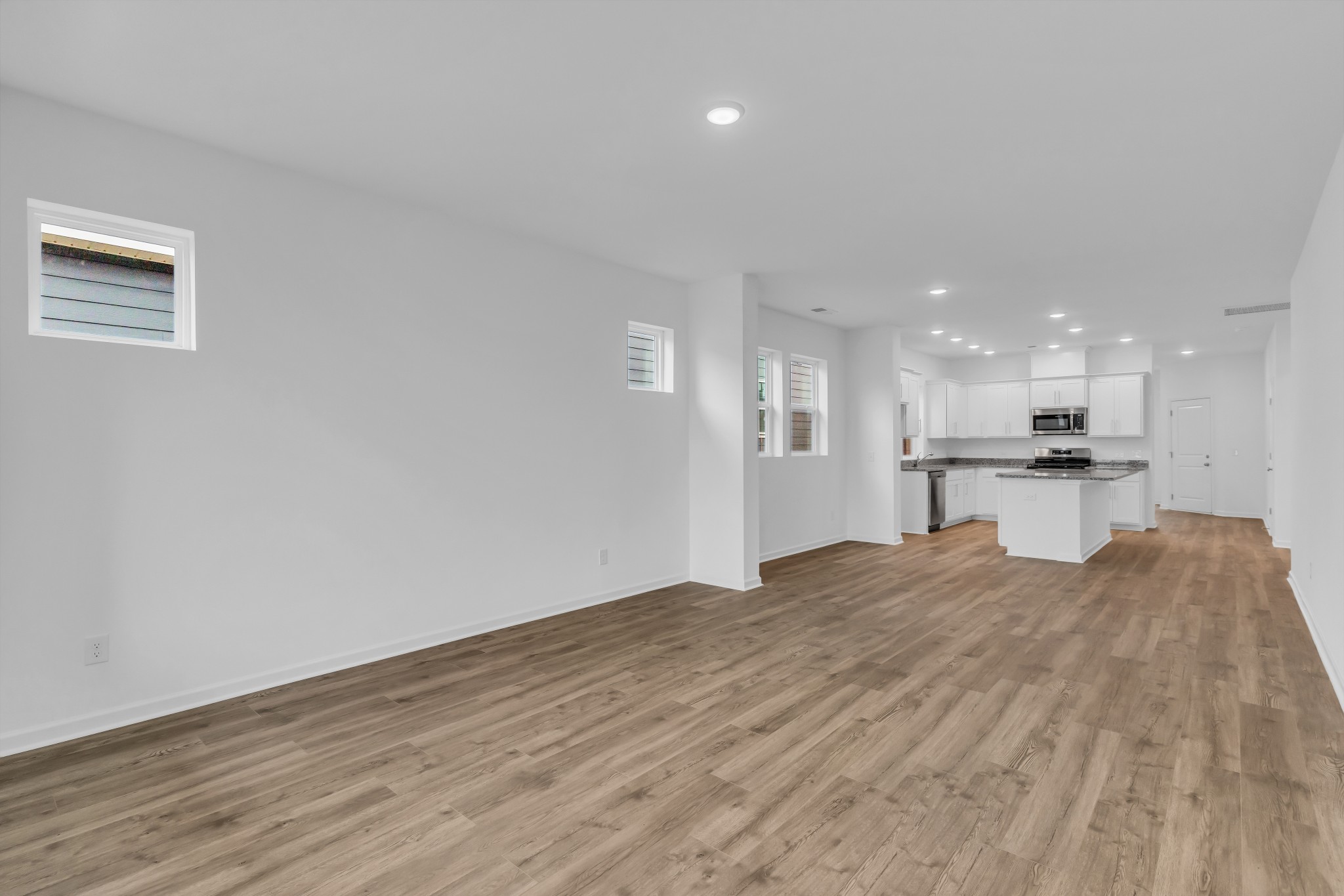 945 Brooklyn Xing Road Gallatin, TN 37066 - Photo 8 of 15 a view of kitchen with kitchen island sink and refrigerator