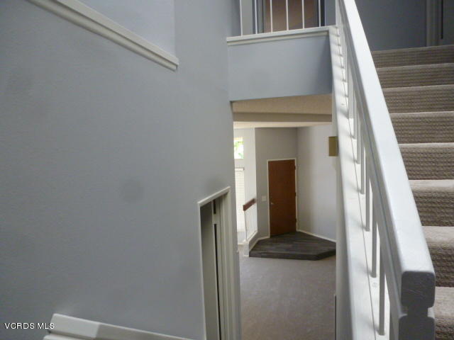 1736 Sinaloa Road, Unit 321 Simi Valley, CA 93065 - Photo 15 of 26 a view of a hallway with wooden floor and staircase