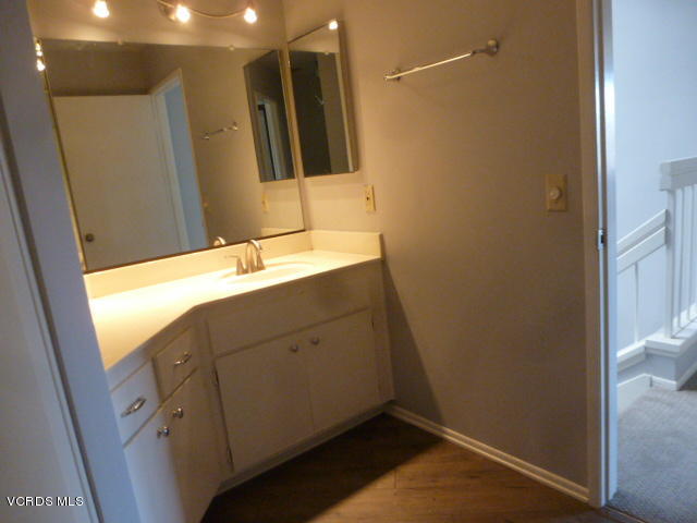 1736 Sinaloa Road, Unit 321 Simi Valley, CA 93065 - Photo 20 of 26 a bathroom with a sink and a mirror