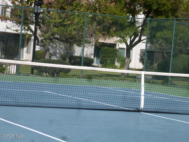 1736 Sinaloa Road, Unit 321 Simi Valley, CA 93065 - Photo 4 of 26 a view of a tennis court