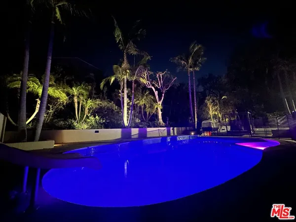 a view of swimming pool with outdoor seating