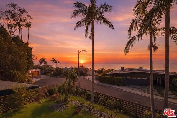 a view of beach and patio